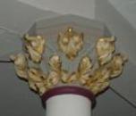 pillar, capped with fleur de lis and olive leaf designs
